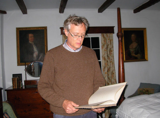 John Cox, current heir to the estate, reads from the family records of the house on Orange Valley Road